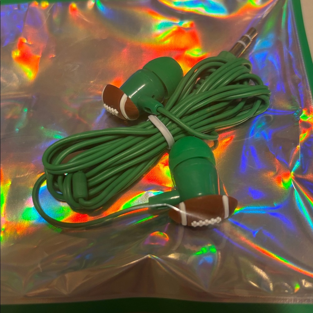 Green Wired Earbuds plug ins. Green with football on ends. New no tags